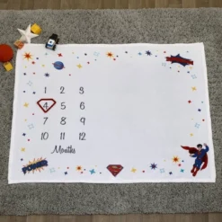Warner Bros. Superman Milestone Baby Blanket -Graco Shop GUEST 81271872 bc28 4702 8103 d37f635b56c0